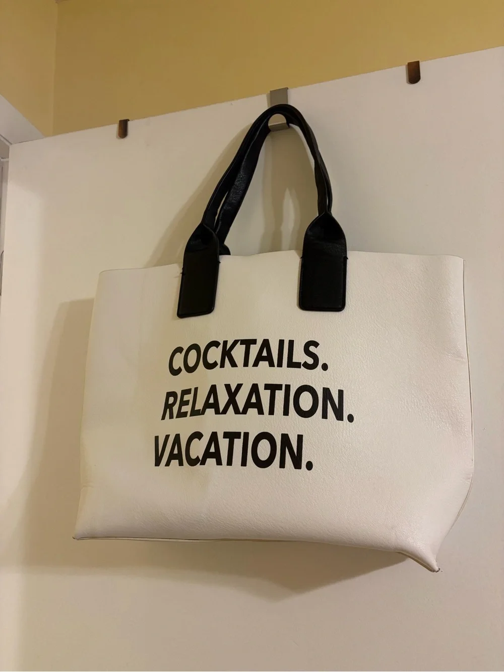 White Tote Bag with Black Handles and Bold Black Text